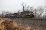 NS 9686 with aneastbound train of coal hoppers